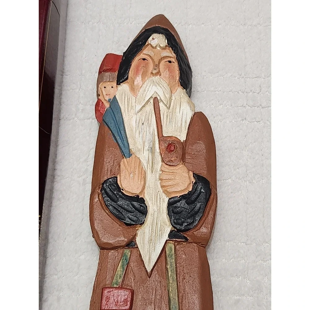 Grandeur Noel Collectors Edition Carved Wood Santa of the World Figures Set Of 2